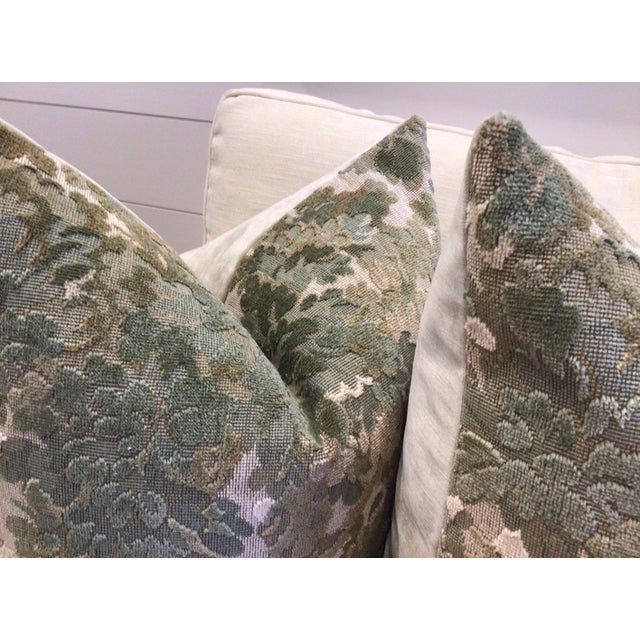 Covered in a rich fabric by famed design house Cowtan and Tout, "Walden" in color Sage is a plush green raised velvet...