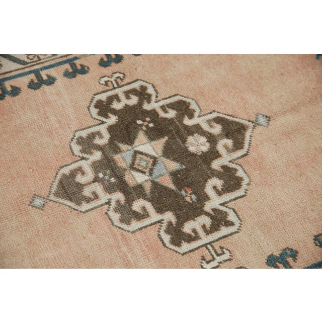 Introducing a one-of-a-kind vintage Turkish hand-knotted wool rug, carefully crafted by skilled artisans using traditional...