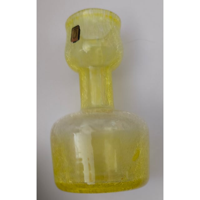 The factory became famous for its "Fátyolüveg" (veil glass or spiderweb glass), a mouth-blown glass often crafted in...