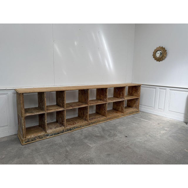 A stunning patina gives this large, elegant shop-style shelving unit, dating from the 1920s, a truly captivating piece....
