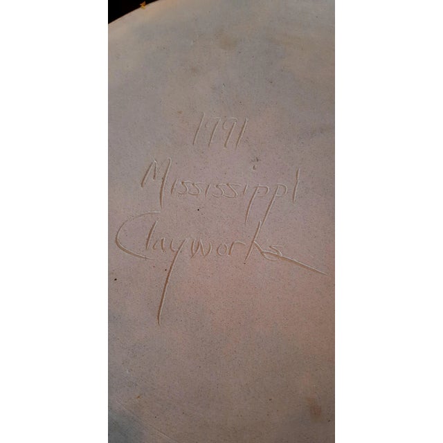 Signed handmade blue and white swirl pottery trivet. Gold rim around edge signed on bottom. Gorgeous coloring. Please use...