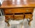 This piece serves as both a functional storage and a formal statement piece for traditional interiors. It is a classic...