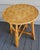 This vintage 1960's round accent table has a woven top. It could make a small dining table or a side table for most any...