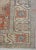 Soft hues of neutrals, flesh tones and blues form this lovely hand-knotted Oushak rug which was made in the early 20th...