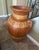 Beautiful oversized decorative floor pot featuring a warm terracotta/rust finish with cream and gold-toned floral and...