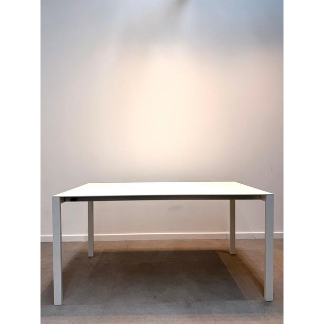 Elegant and highly functional extendable dining table by Kristalia, featuring a minimalist Italian design with a white...
