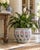 A beautifully decorative late 20th-century ceramic fishbowl planter featuring a soft chinoiserie palette of cobalt blue,...