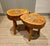 Exceptional pair of sculptural solid wood stools handcrafted from natural tree trunk sections, embodying the essence of...
