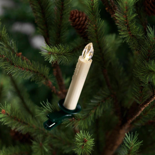 Illuminate your holiday decor with the warm, flickering glow of these LED Clip-On Tree Taper Candles. Designed to mimic...