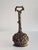 A beautiful doorstop made of solid brass, shaped like a harvest basket filled with fruit, flowers, and ears of grain....