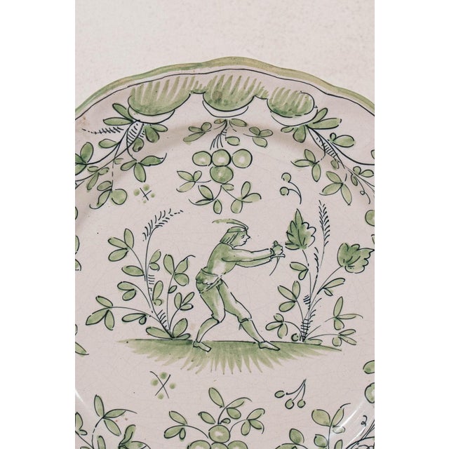 Sold with the attached (removable) antique plate hanger. Moustiers pottery (faïence de Moustiers) is highly celebrated...