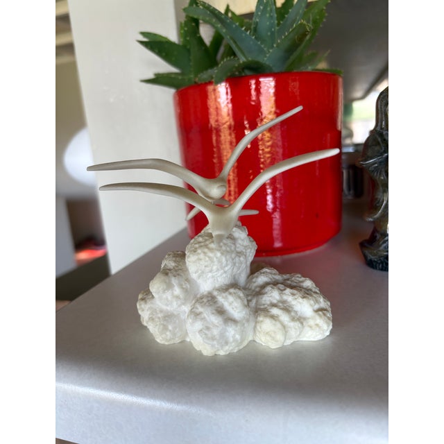 Elegant off-white seagull pair sculpture mounted on a textured cloud (rock) base. This item adds a coastal touch to any...