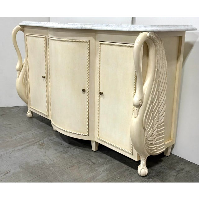 Elegant Maitland-Smith Traditional Cream Swan Katherine Credenza, carved swan design, claw feet, three doors, six shelves,...