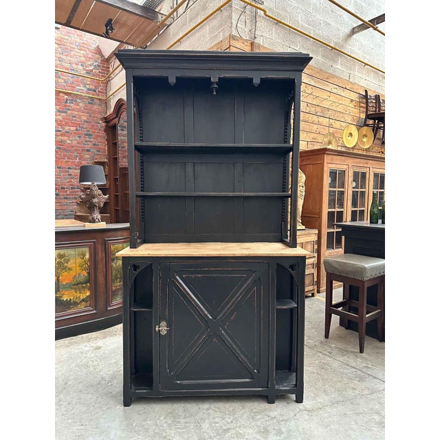 This antique bar cabinet has been fully restored. It features an upper section with large shelves for displaying a...