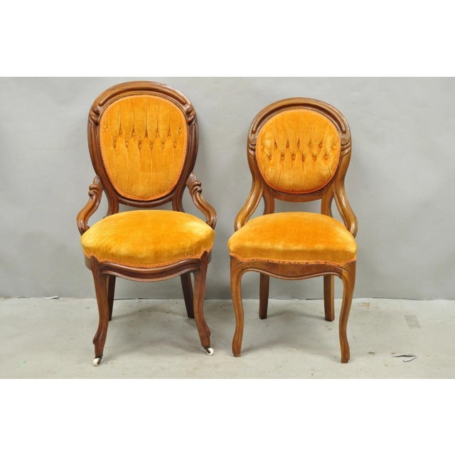 Antique Eastlake Victorian Carved Walnut His and Hers Parlor Side Chairs with Orange Tufted Upholstery - a Pair. Circa...