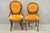 Antique Eastlake Victorian Carved Walnut His and Hers Parlor Side Chairs with Orange Tufted Upholstery - a Pair. Circa...