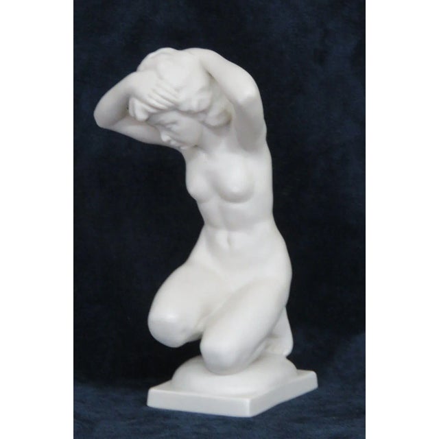 This lovely figurine is made of porcelain. This piece is stamped as being made by Karl Tutter for Hutschenreuther in...