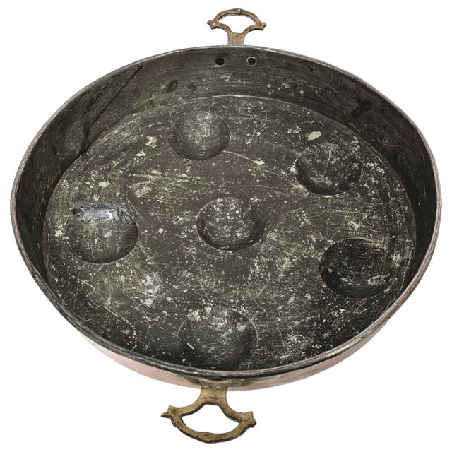 A striking expression of French culinary design, this vintage escargot pan unites sculptural form and enduring function....
