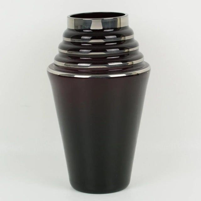 A lovely 1930s French Art Deco black glass vase. Silver deposit decoration all around with geometric patterns. Please note...