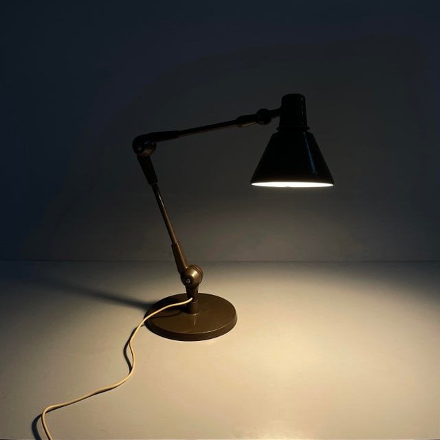 Italian mid-century modern brown table lamp by Stilnovo, 1960s Adjustable table lamp with a round metal lamp shade, white...