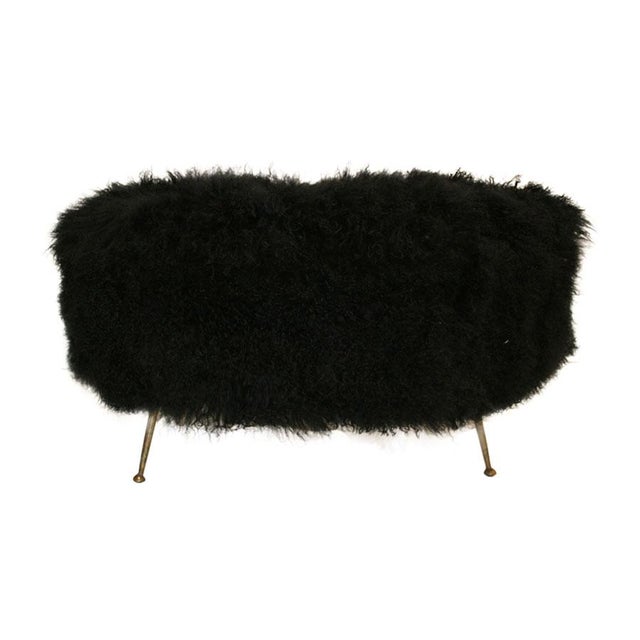 Italian bench with solid wood structure, upholstered in Mongolian goat leather. Legs in lacquered black metal and finished...