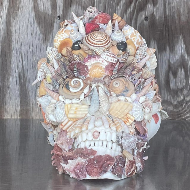 An fantastic vintage Boho skull. A chic shell encrusted composition. Signed by the artist on the bottom. Acquired from a...