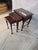 A classic set of vintage 3-piece nesting tables crafted in a rich mahogany finish, featuring elegant Queen Anne cabriole...