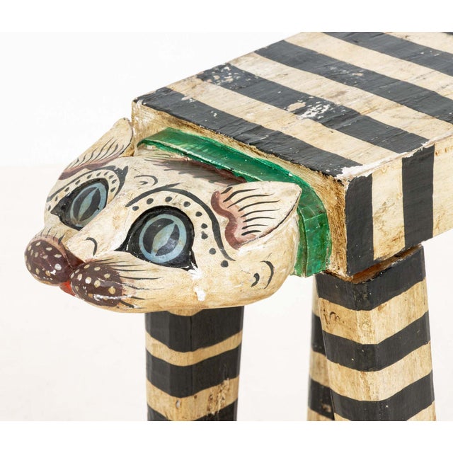 Folk Art Polychrome Painted and Carved Wood Double Cat Head Stool. 16" H x 20" W x 8.5" D. Provenance: From a New York...