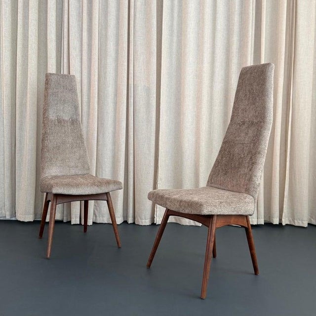 This outstanding pair of high-back dining side chairs designed by Adrian Pearsall for Craft Associates are model number...