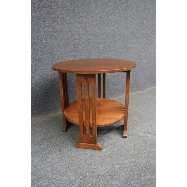 Authentic Stickley Arts & Crafts round lamp table crafted of solid quarter sawn oak with a warm medium oak finish. This...