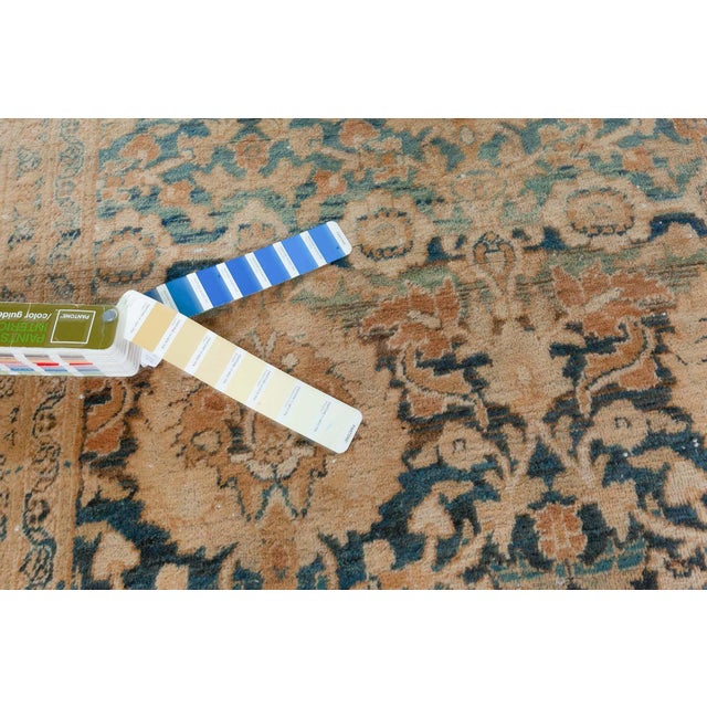 This circa-1920 antique Persian Meshad rug has a stunning all-over design of arabesques, floral motifs and leaved vinery...