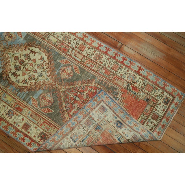 Predominant light blue gray orange Persian tribal geometric runner from the early 20th century. Measures: 3' x 15'9".