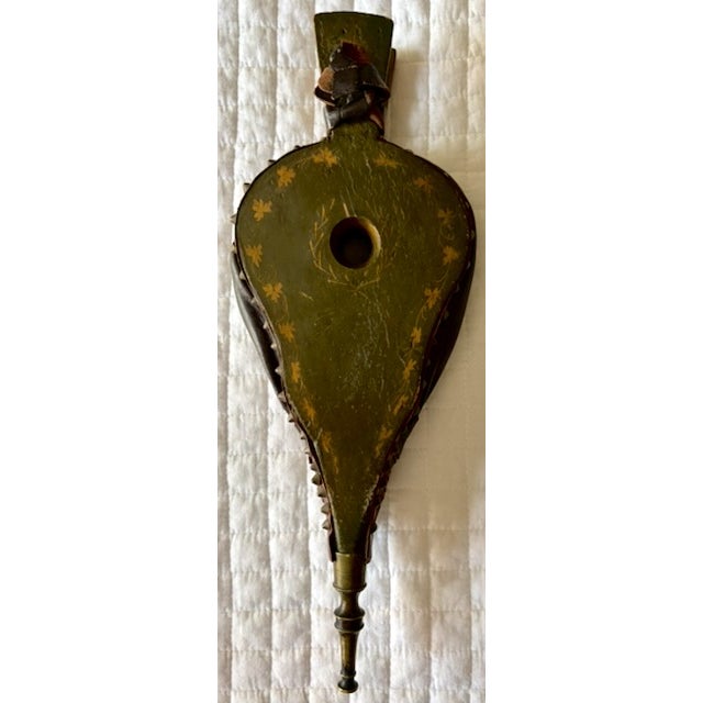 A pair of antique French small sized bellows with original leather and brass stud work, decorated with a traditional...