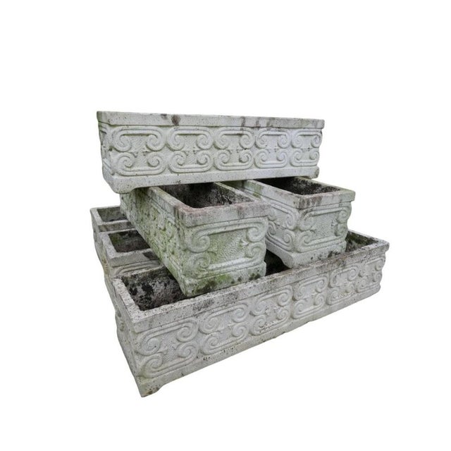 Transform your garden or patio with this exquisite Set of Six Reconstituted Stone Planters. Featuring intricate scrollwork...