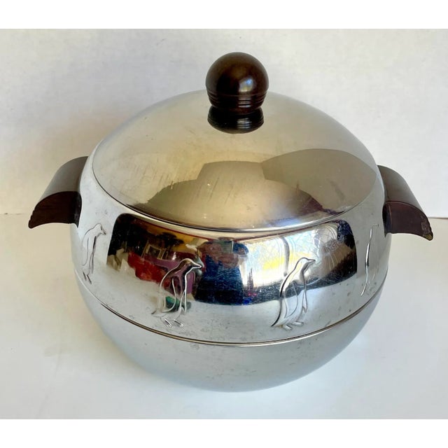 Here is a piece that is a staple of mid-century design! It is a lidded serving dish that features penguins around the...