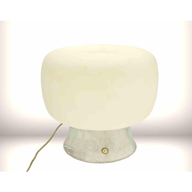 Original space age lamp, from 1970s. Working lamp with Tin base and glass head. Measures: 36x35 cm. Up to 250V (Europe/UK...