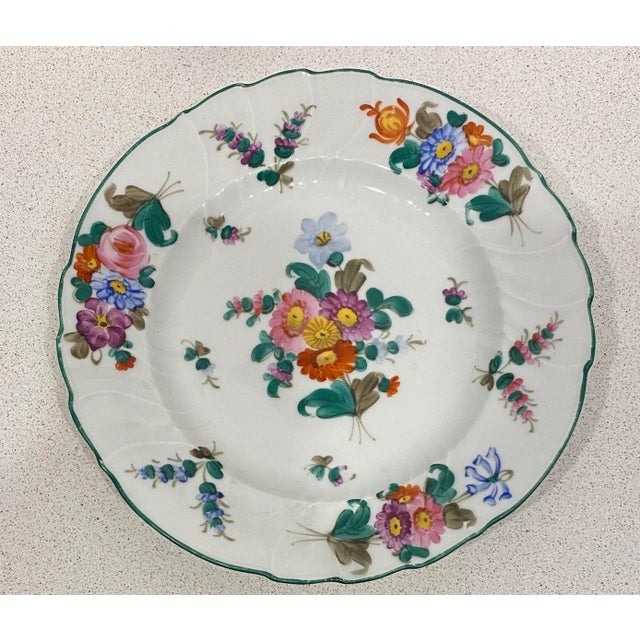 A lovely colorful floral design adorns this set of hand painted porcelain dishes. Two dishes have the same design, while...