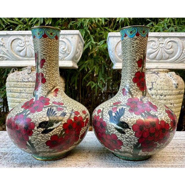 Stunning Pair of 1880s Chinese Cloisonne mirrored Vases with Bird floral pattern This exquisite pair of late 19th-century...