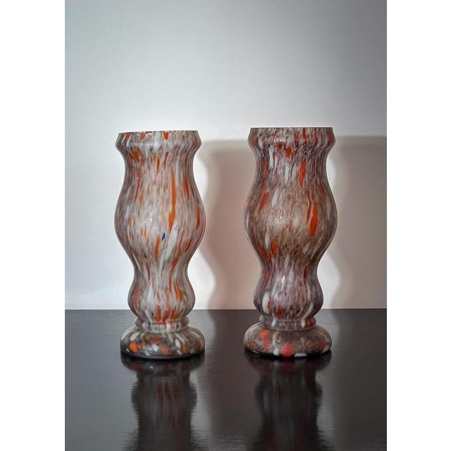 This pair of French Art Deco marbled cased glass vases, crafted circa 1930s, showcases the refined artistry of the period....