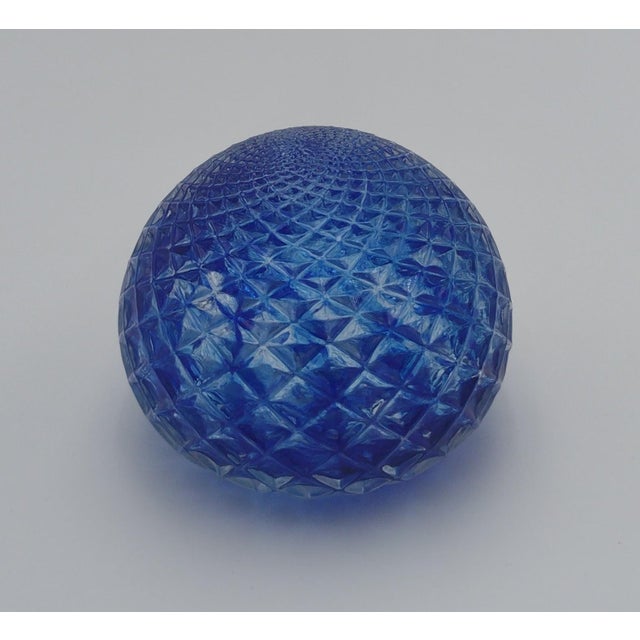 Add a striking pop of color and artisan craftsmanship to your décor with this beautifully handblown glass paperweight in...