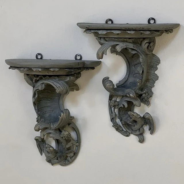 Pair 18th Century Rococo Period Painted Wall Sconces are remarkable works, celebrating the asymmetrical naturalism of the...
