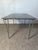 Original Fritz Hansen table Design by Piet Hein, Bruno Mathsson and Arne Jacobsen Dark iridescent veneered wooden top in...