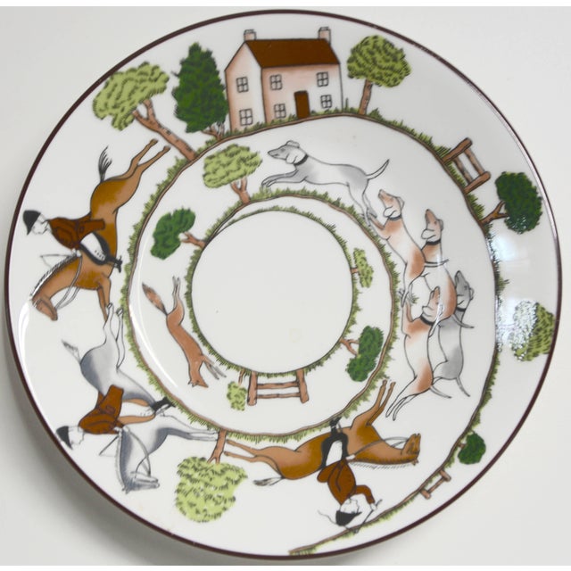 An equestrian scene decorates this set of three bread and butter bone china plates by Wedgewood of England. They are the...