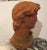 Romantic sculptural bust in earthy terracotta of the classically handsome David.
