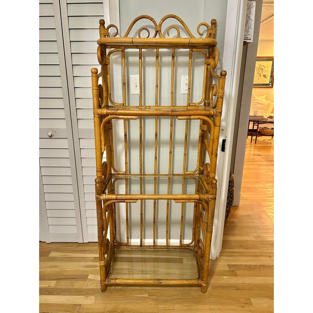 Add storage and display space to any home with this vintage rattan etagere. Whether you call it Hollywood Regency, Palm...