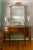 An exceptional vintage Carvers' Guild Panier de Fleur Mirror, beautifully crafted and richly detailed, this statement...