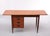 This writing desk was designed by Arne Vodder and was produced in Denmark in the 1960s. It is made from teak and features...