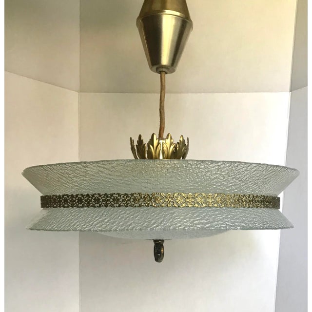 This is a GORGEOUS chandelier from the mid-century that I believe was designed by Carl Fagerlund. From what I can tell,...