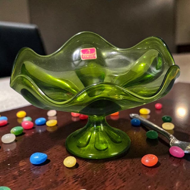 This Vintage Mid-Century Modern Viking Glass Avocado Green Ruffled Edge Compote Bowl is a handmade candy dish from the...