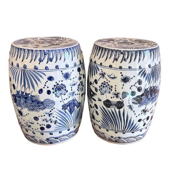 This is a pair of beautiful blue and white porcelain garden stool with a vibrant design of beautiful sea life and fish....